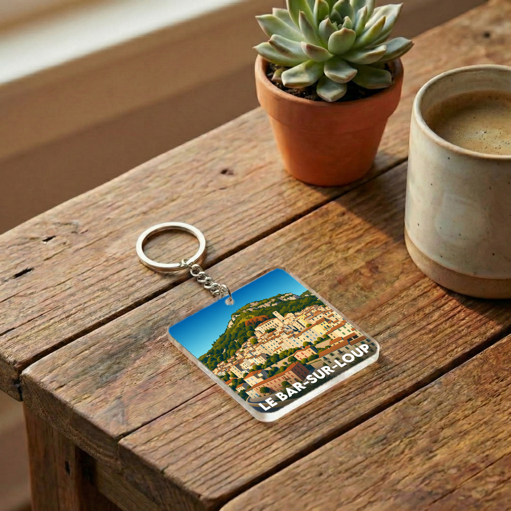 Porte-clés souvenir de la ville de Le Bar-sur-Loup avec une illustration stylisée.