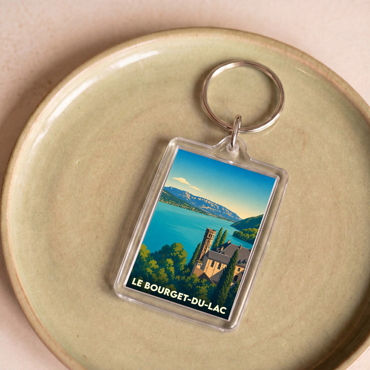 Porte-clés souvenir de la ville de Le Bourget-du-Lac avec une illustration stylisée.