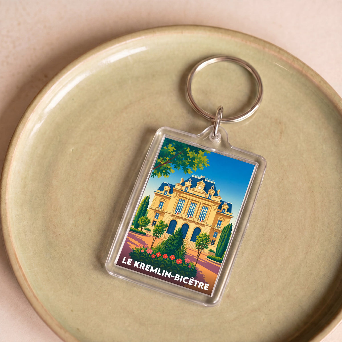 Porte-clés souvenir de la ville de Le Kremlin-Bicêtre avec une illustration stylisée de son architecture.