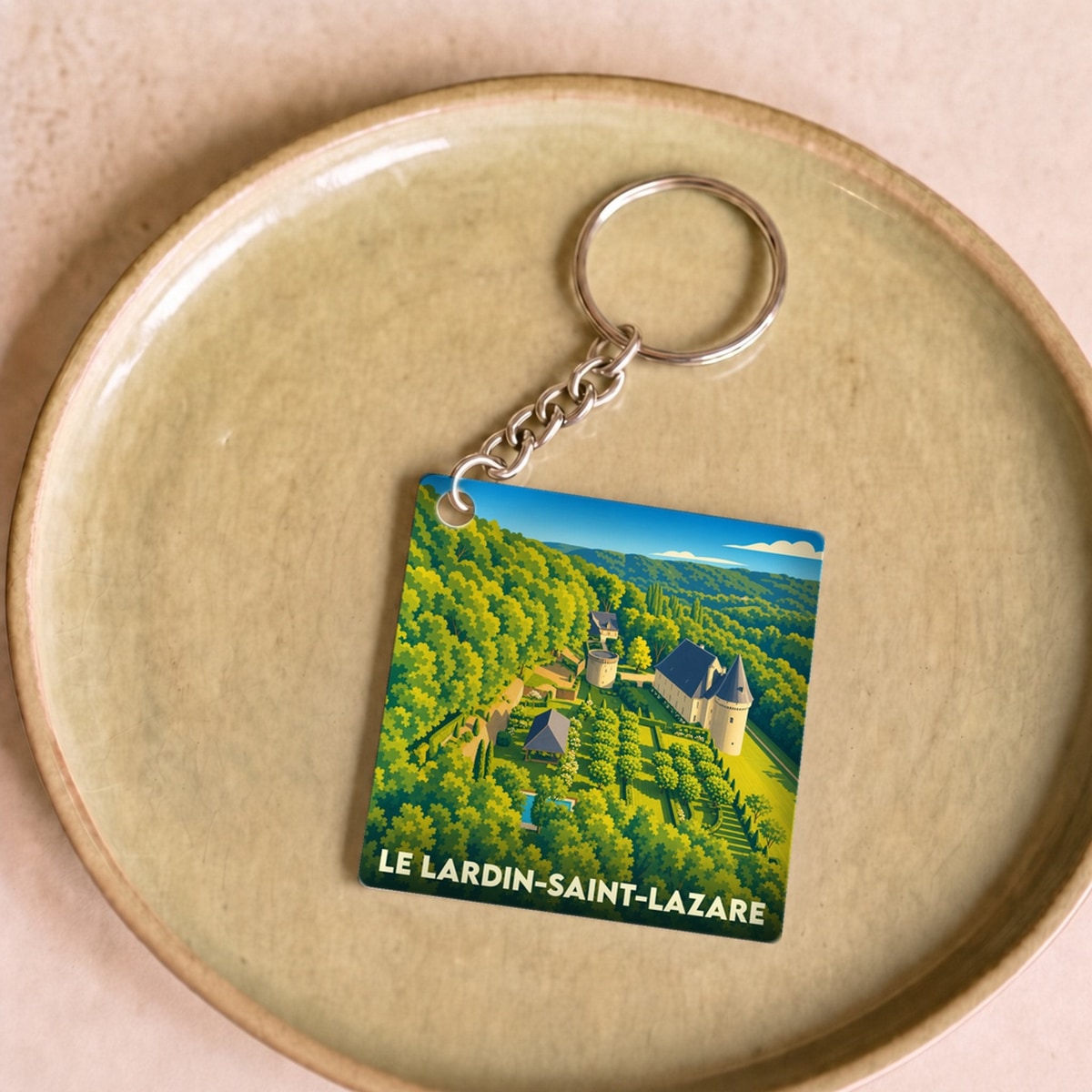 Porte-clés souvenir de la ville de Le Lardin-Saint-Lazare avec une illustration stylisée.