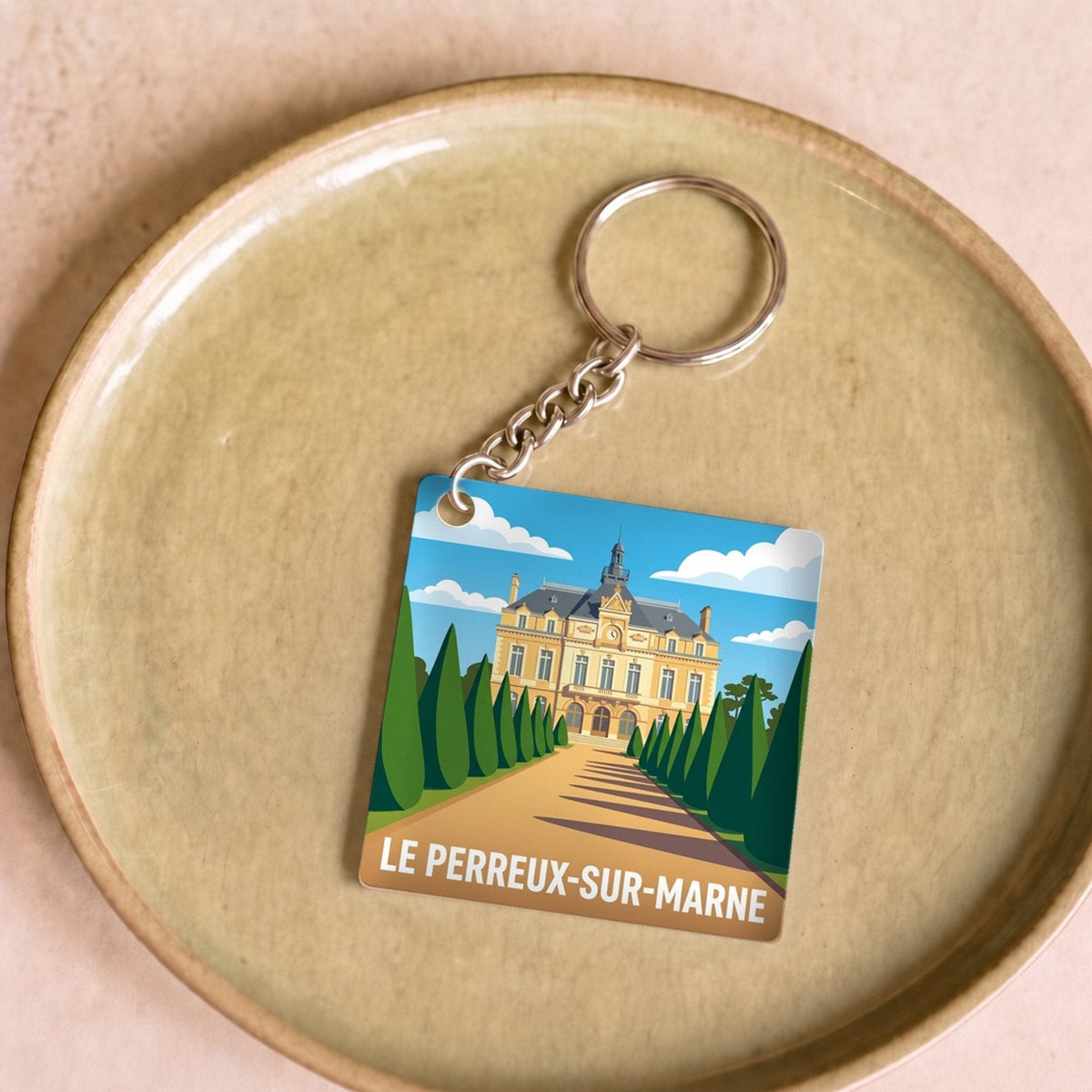 Porte-clés souvenir de la ville de Le Perreux-sur-Marne avec une illustration stylisée.