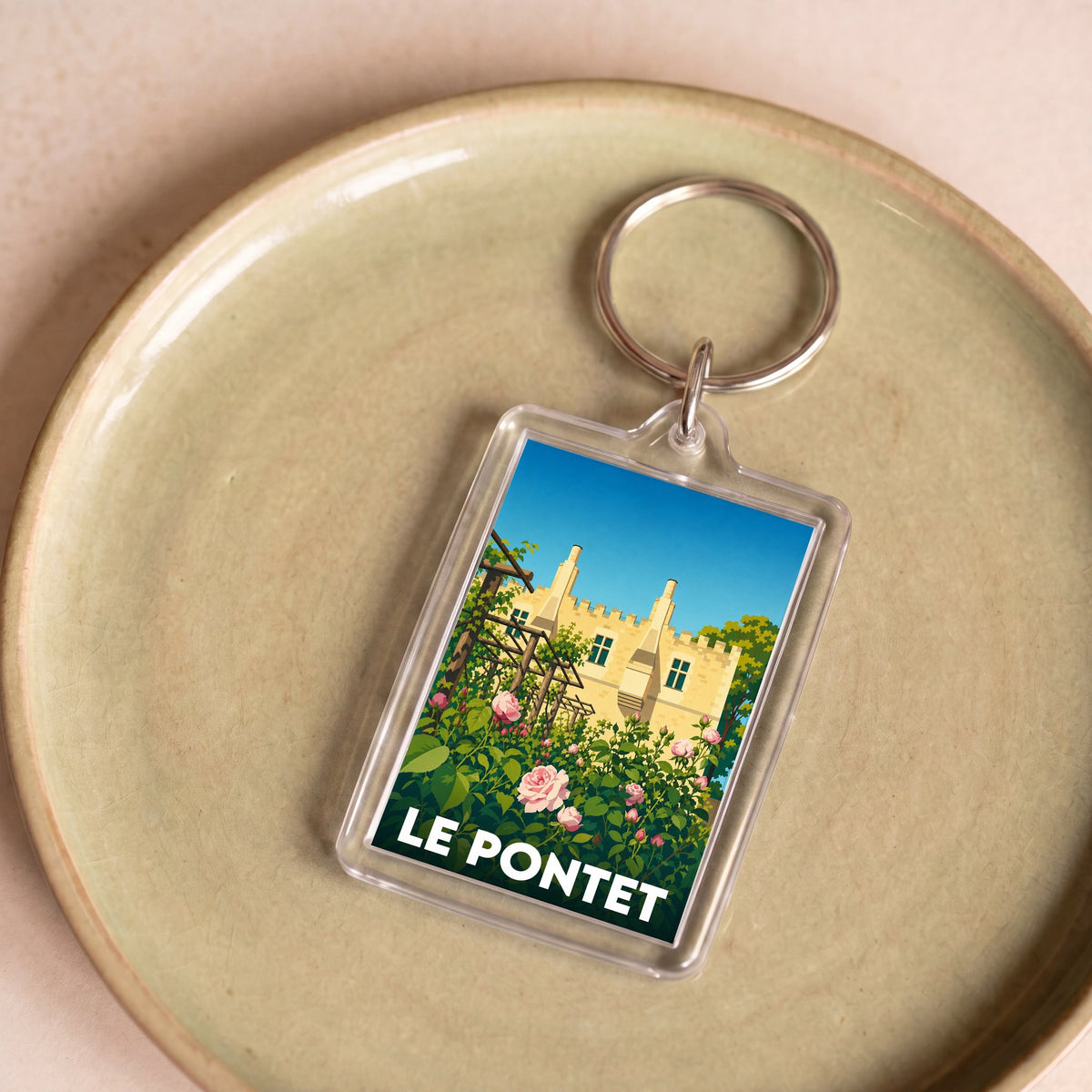 Porte-clés souvenir de la ville de Le Pontet avec une illustration stylisée.