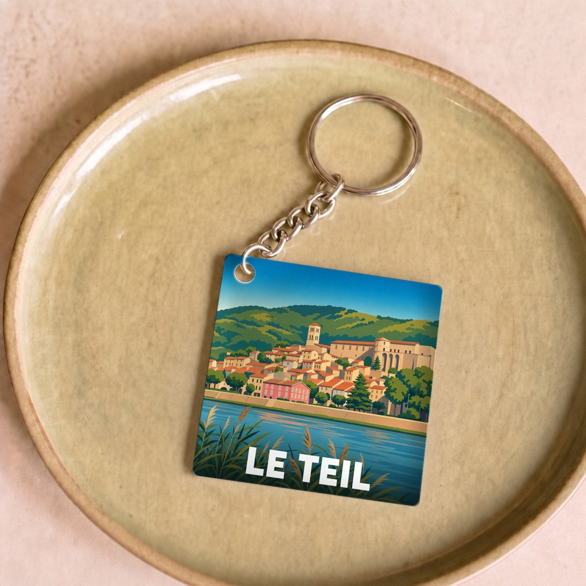Porte-clés souvenir de la ville de Le Teil avec une illustration stylisée.