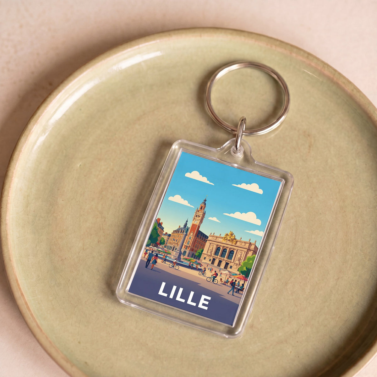 Porte-clés souvenir de la ville de Lille avec une illustration stylisée.