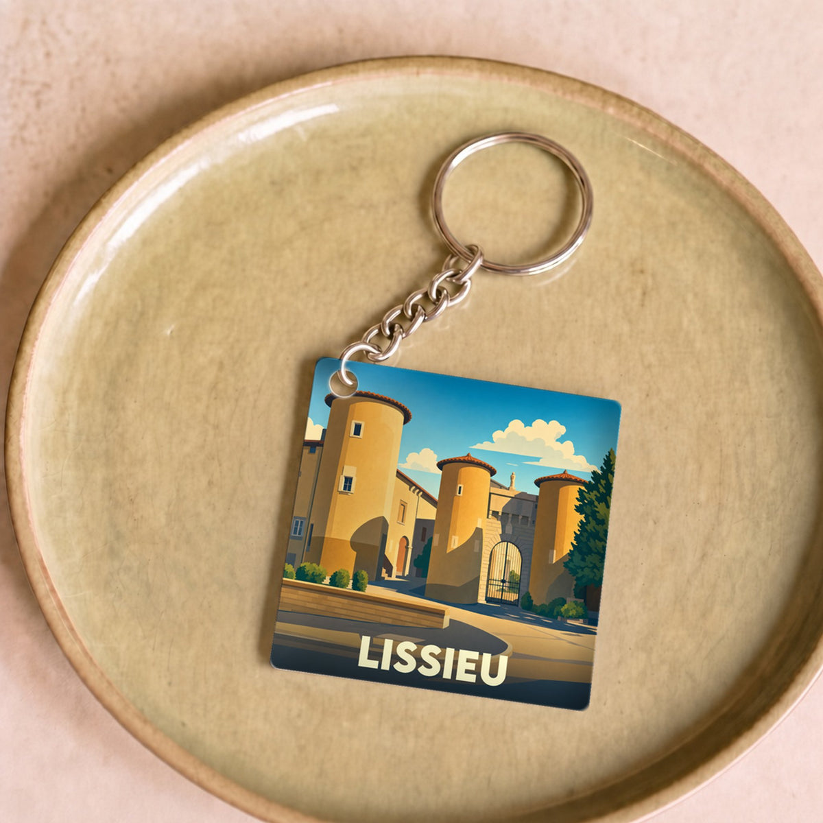 Porte-clés souvenir de la ville de Lissieu avec une illustration stylisée d'un château.