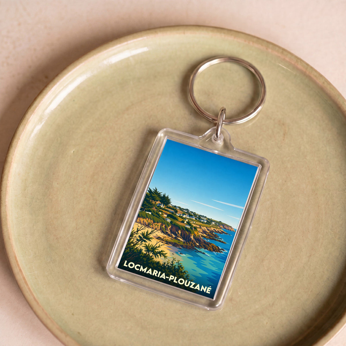 Porte-clés souvenir de la ville de Locmaria-Plouzané avec une illustration stylisée de son littoral.