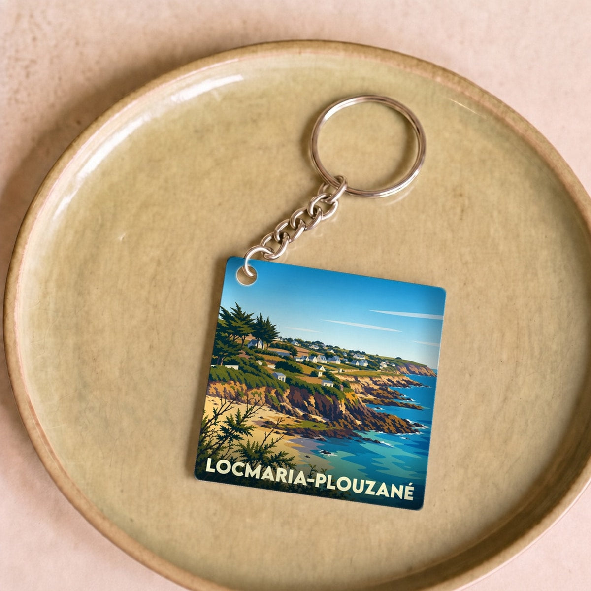Porte-clés souvenir de la ville de Locmaria-Plouzané avec une illustration stylisée de son littoral.