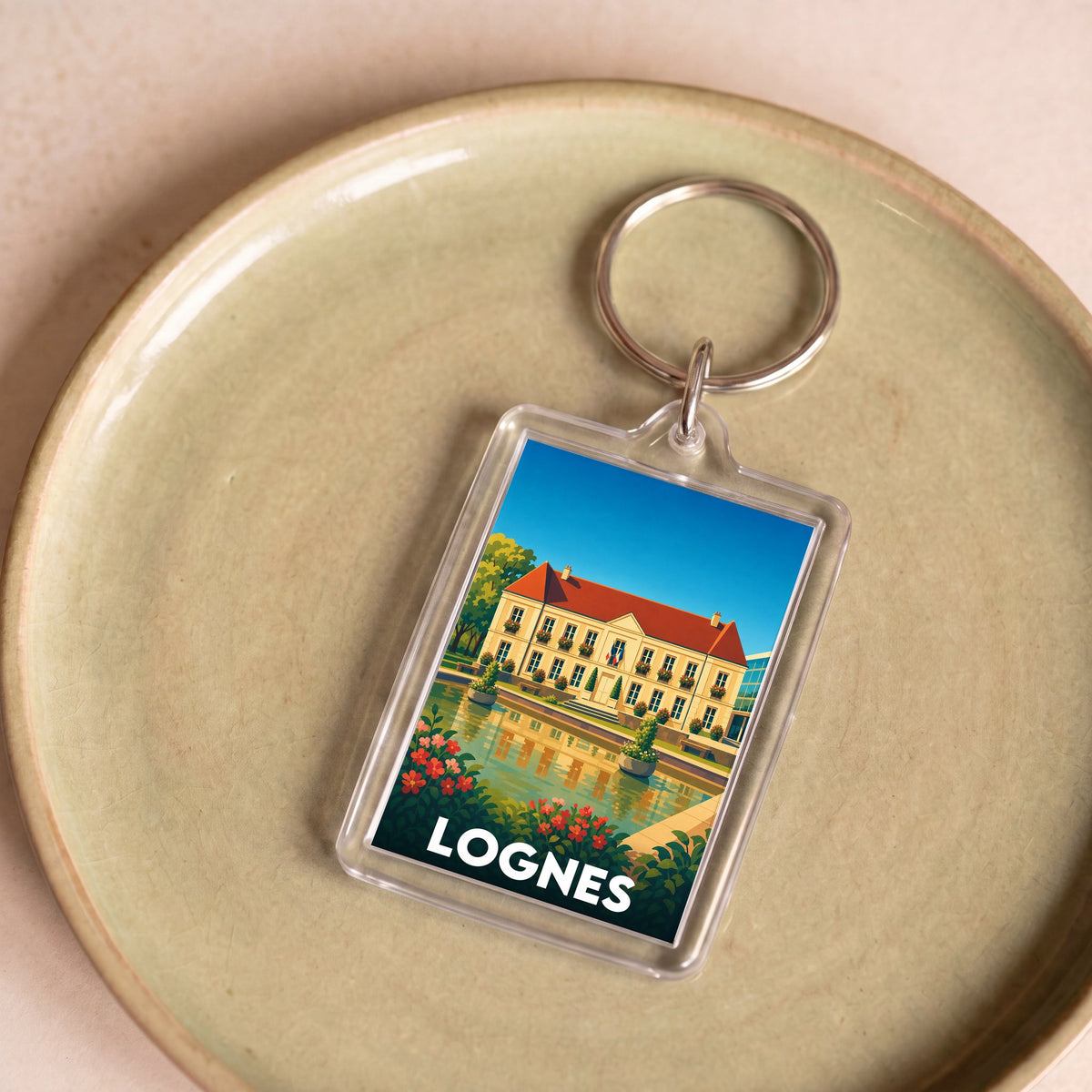Porte-clés souvenir de la ville de Lognes avec une illustration stylisée.