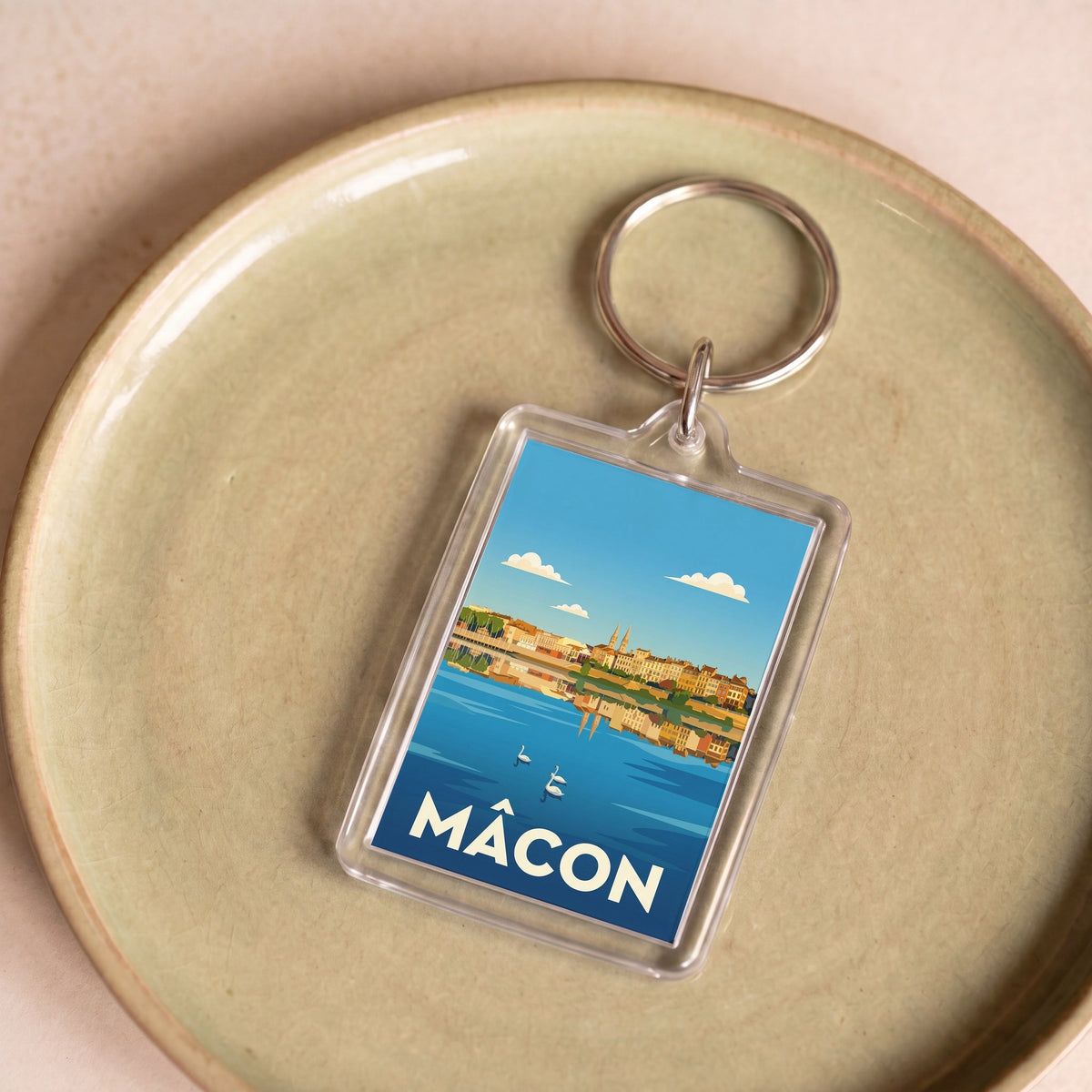 Porte-clés souvenir de la ville de Mâcon avec une illustration stylisée.