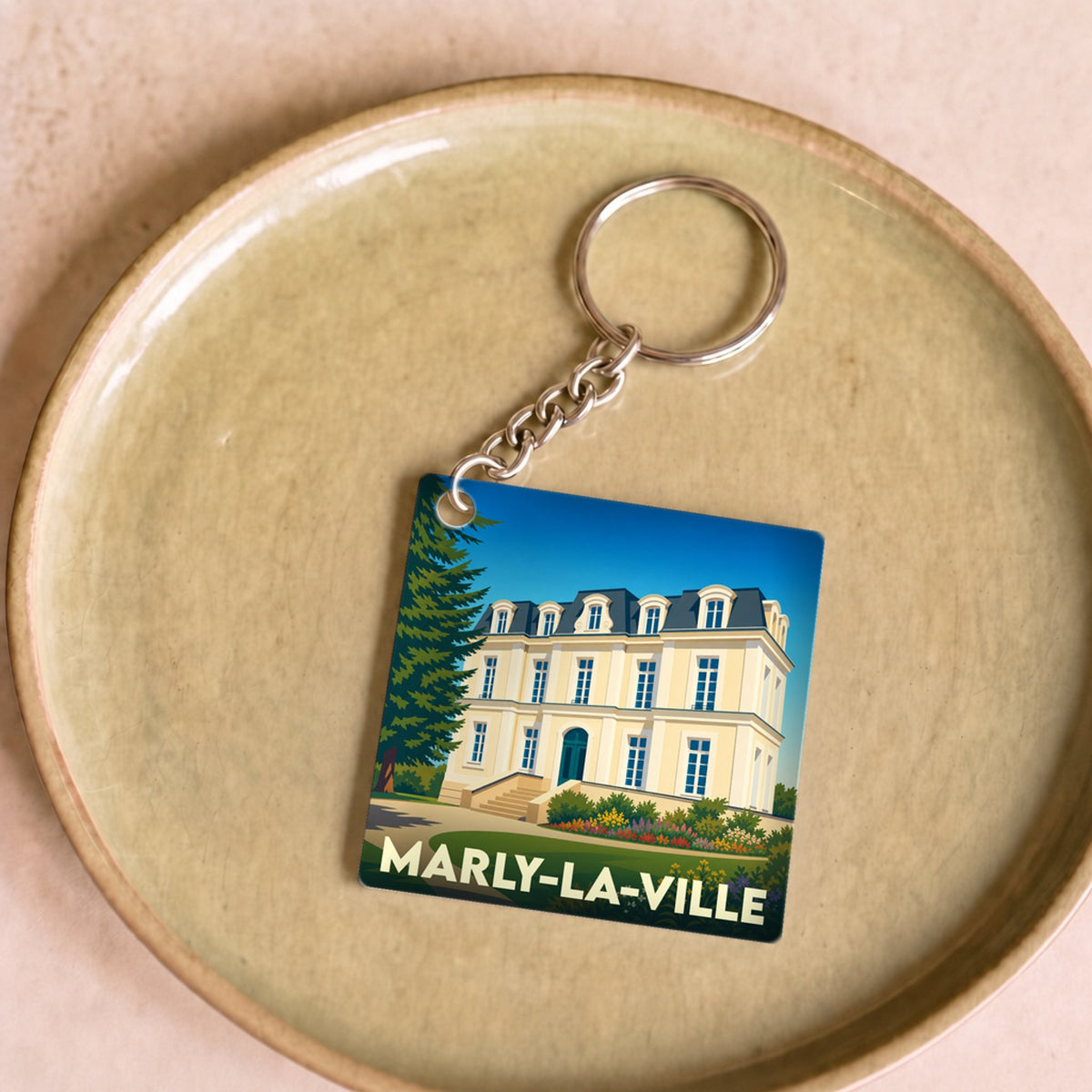 Porte-clés souvenir de Marly-la-Ville avec une illustration stylisée de l'hôtel de ville.