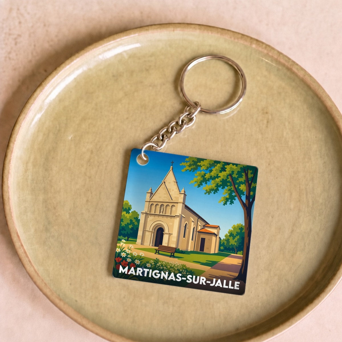 Porte-clés souvenir de la ville de Martignas-sur-Jalle avec une illustration stylisée.