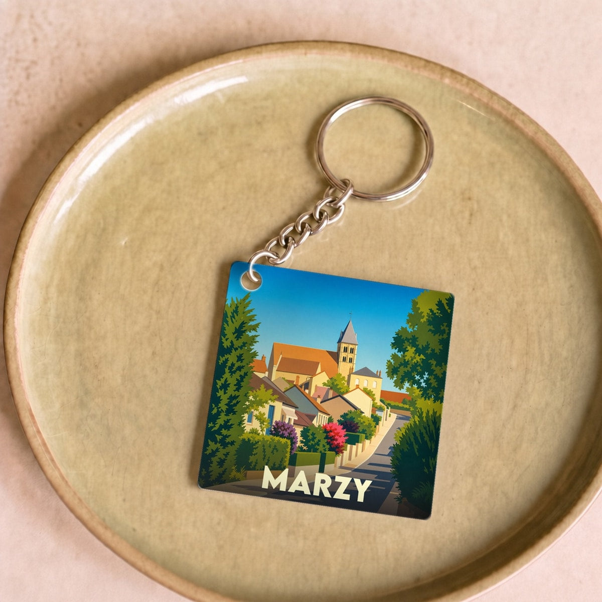 Porte-clés souvenir de la ville de Marzy avec une illustration stylisée.