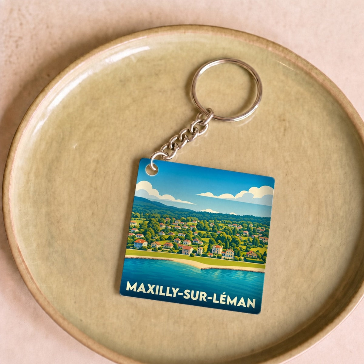 Porte-clés souvenir de Maxilly-sur-Léman avec une illustration stylisée du bord du lac.