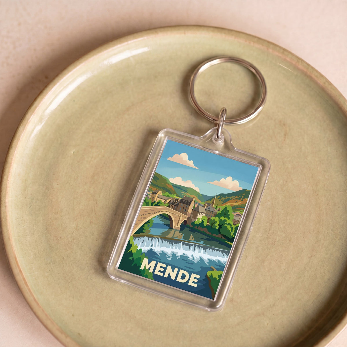 Porte-clés souvenir de la ville de Mende avec une illustration stylisée.