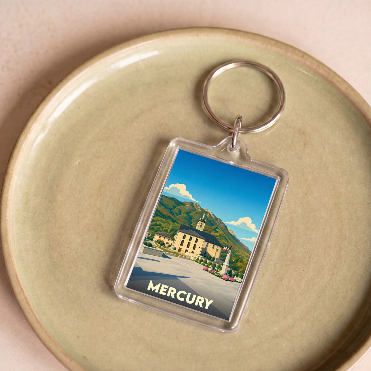 Porte-clés souvenir de la ville de Mercury avec une illustration stylisée.