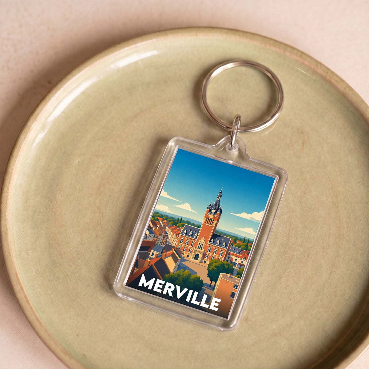Porte-clés souvenir de la ville de Merville avec une illustration stylisée.