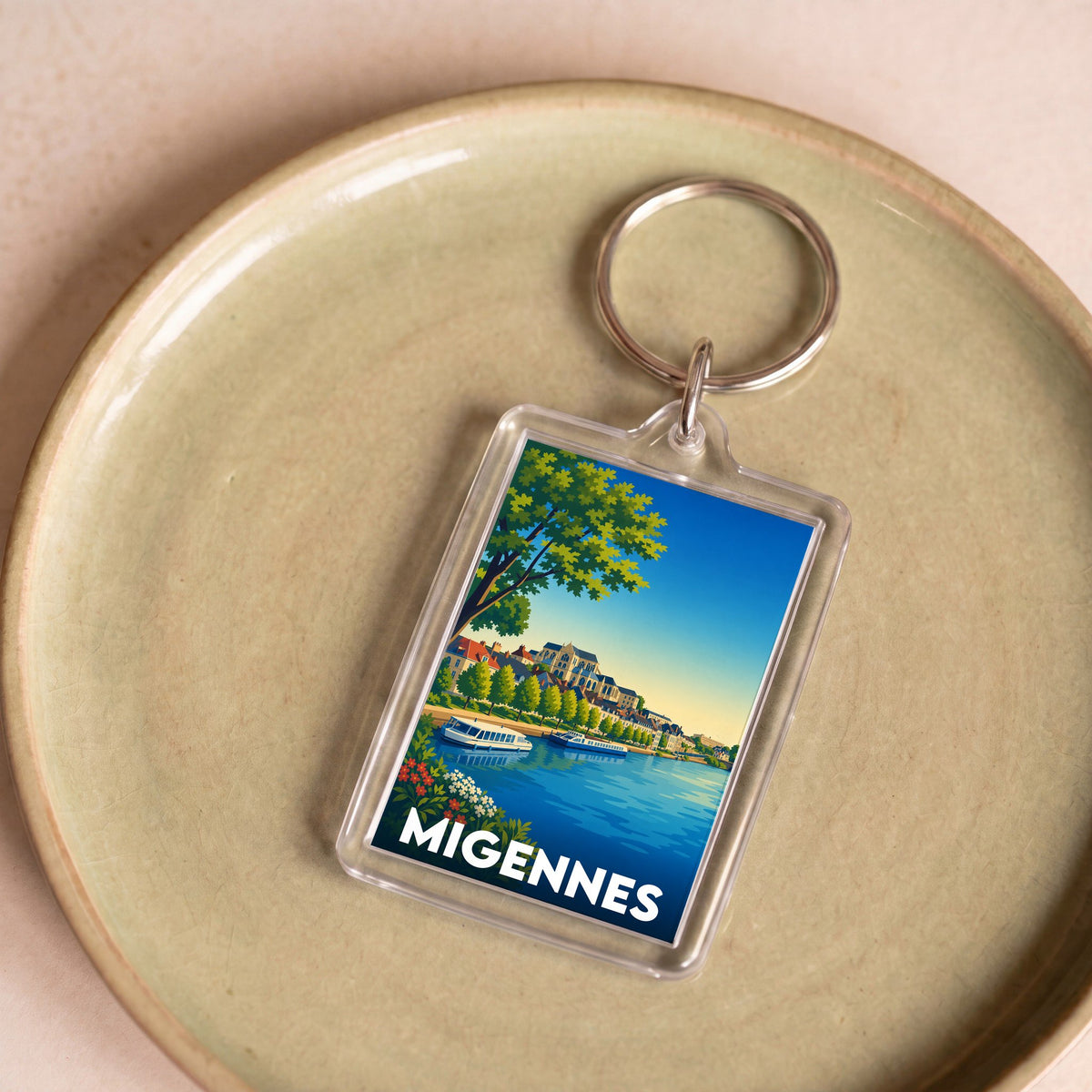 Porte-clés souvenir de la ville de Migennes avec une illustration stylisée des bords de l'Yonne.