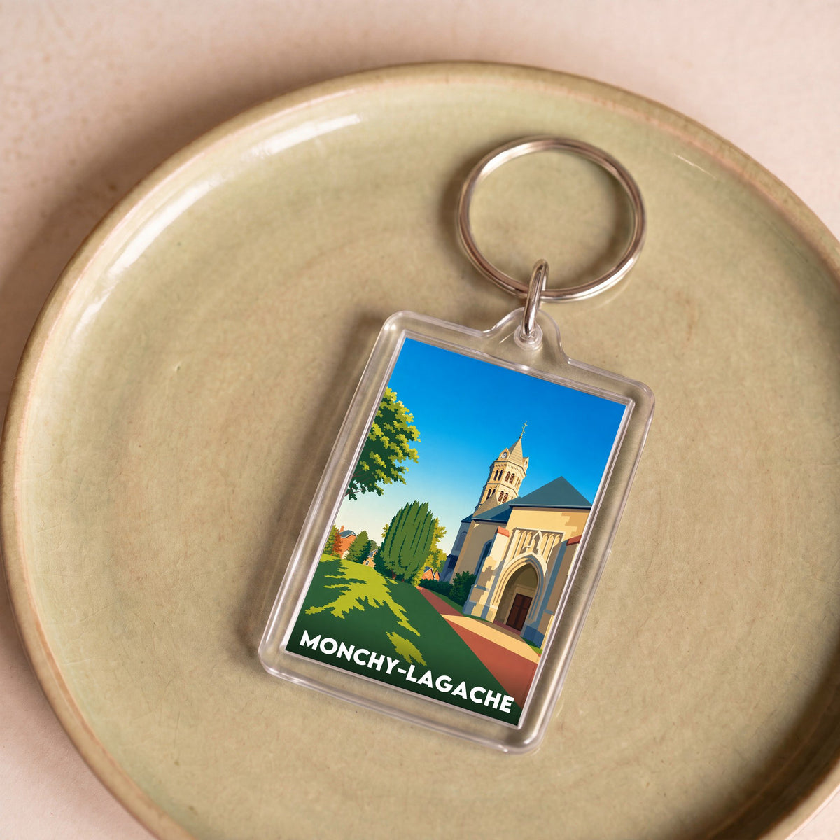 Porte-clés souvenir de la ville de Monchy-Lagache avec une illustration stylisée de son église.