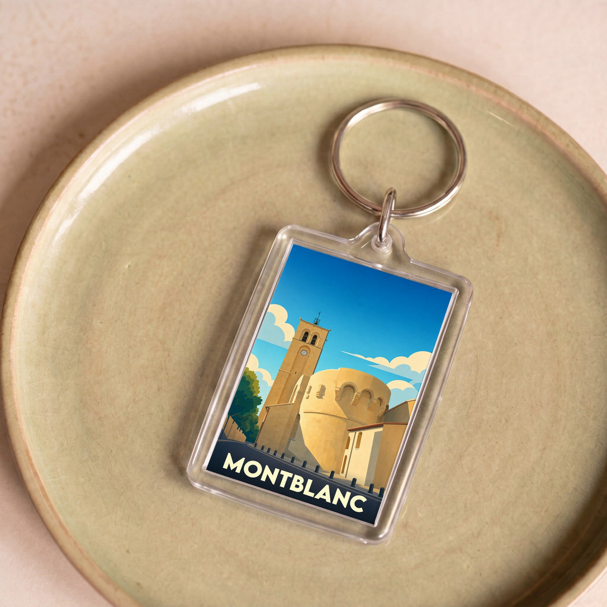 Porte-clés souvenir de la ville de Montblanc avec une illustration stylisée de son patrimoine.