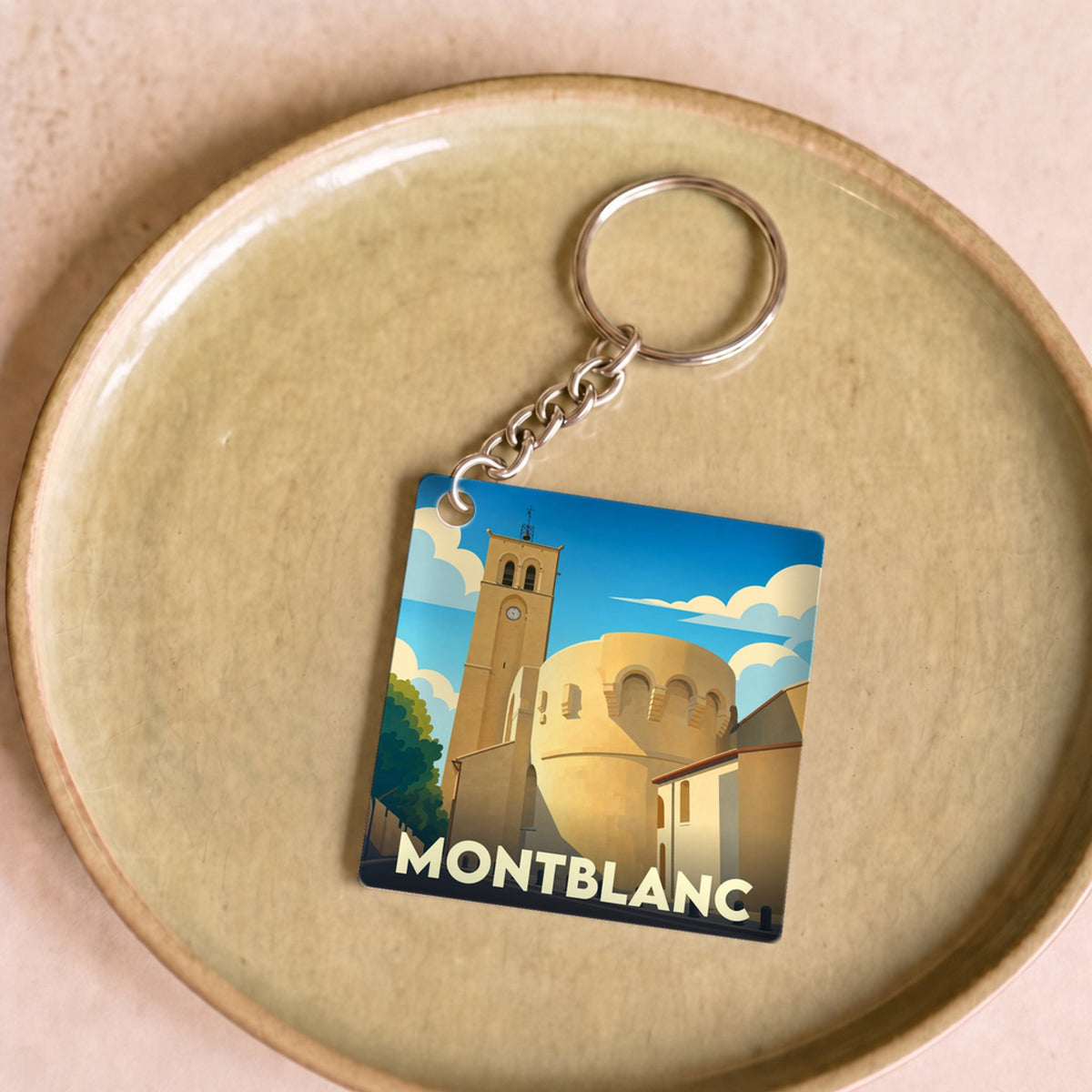 Porte-clés souvenir de la ville de Montblanc avec une illustration stylisée de son patrimoine.