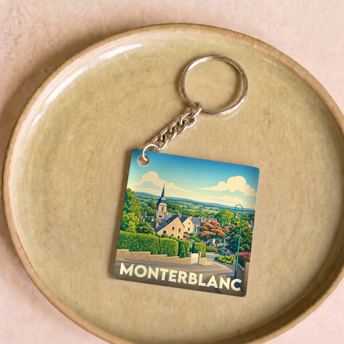 Porte-clés souvenir de la ville de Monterblanc avec une illustration stylisée.