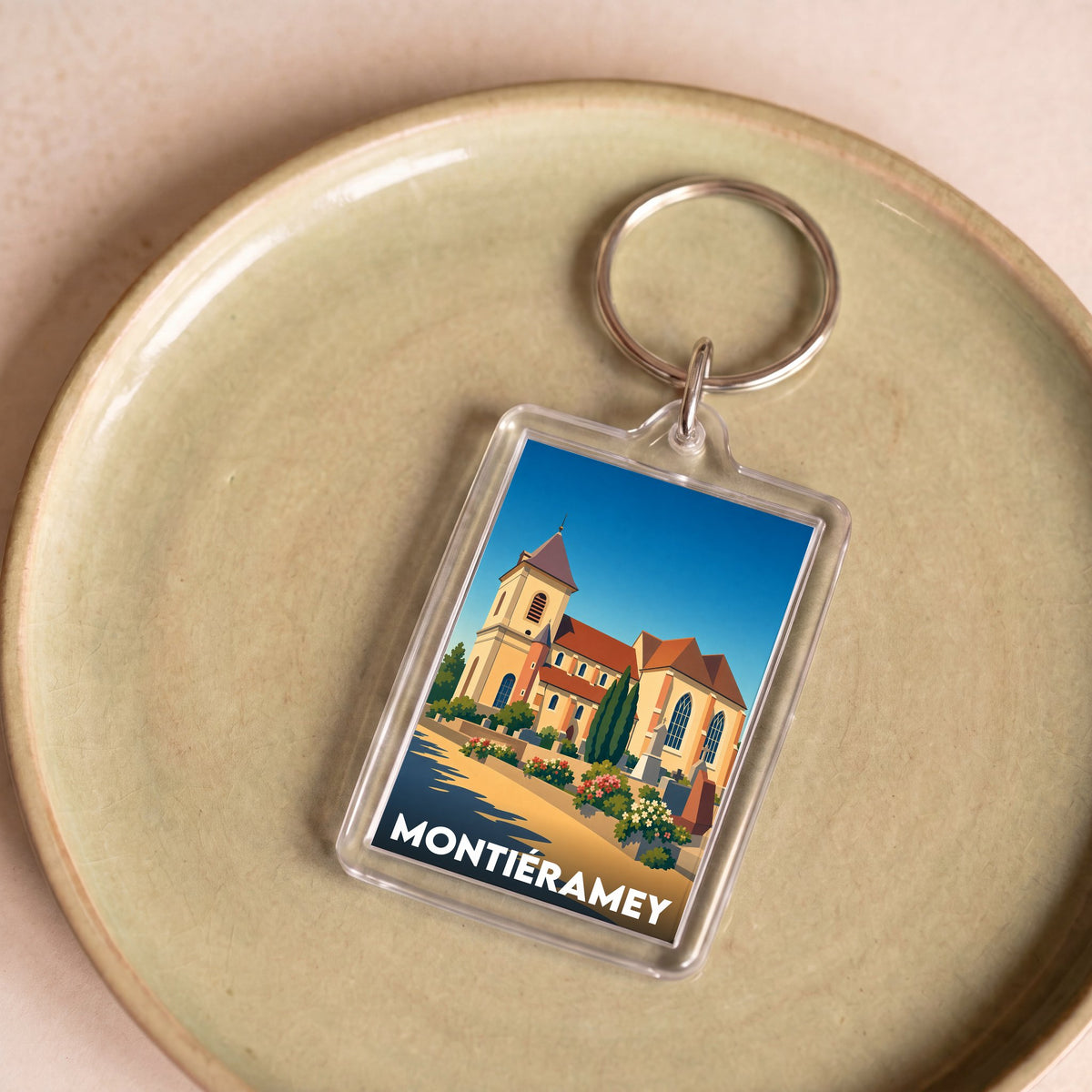 Porte-clés souvenir de la ville de Montiéramey avec une illustration stylisée.