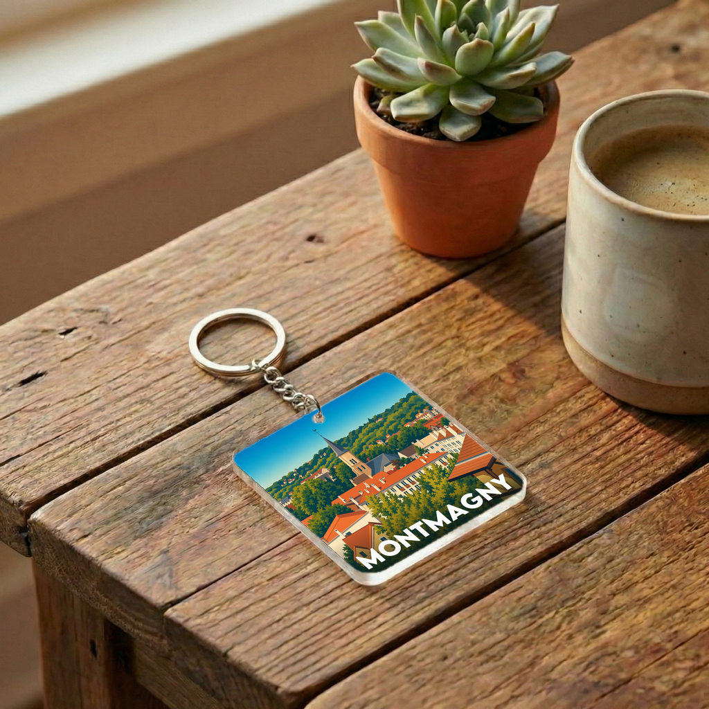 Porte-clés souvenir de la ville de Montmagny avec une illustration stylisée.