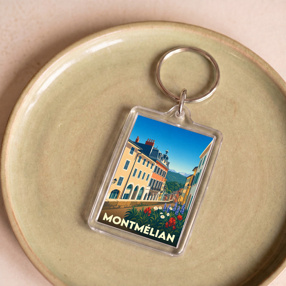Porte-clés souvenir de la ville de Montmélian avec une illustration stylisée.