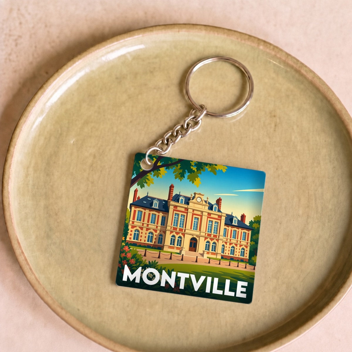 Porte-clés souvenir de la ville de Montville avec une illustration stylisée.