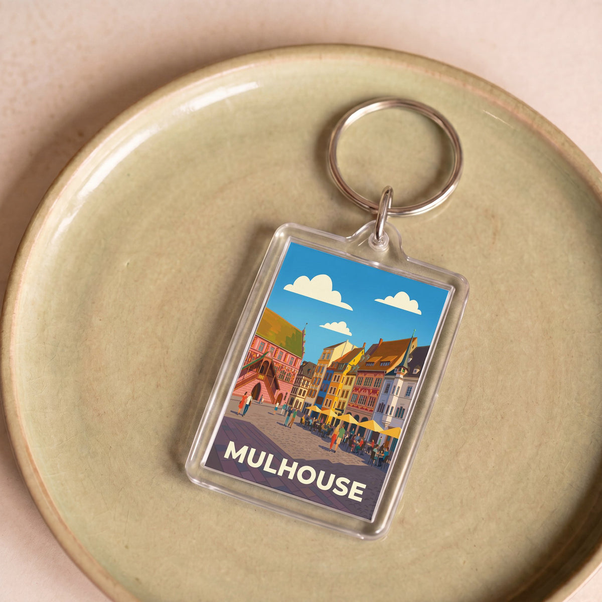 Porte-clés souvenir de la ville de Mulhouse avec une illustration stylisée.