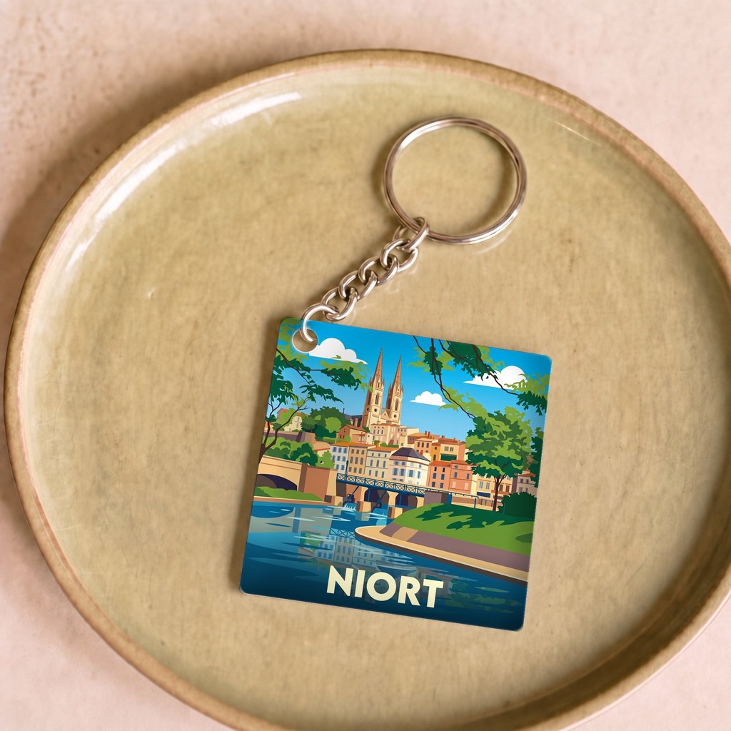 Porte-clés souvenir de la ville de Niort avec une illustration stylisée.