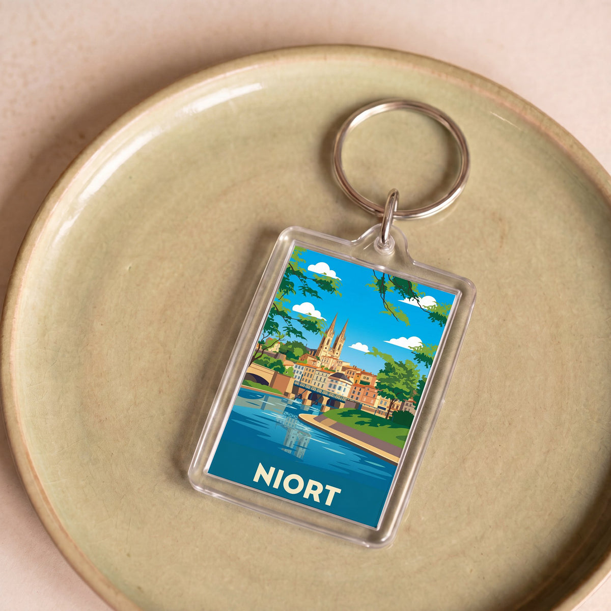 Porte-clés souvenir de la ville de Niort avec une illustration stylisée.