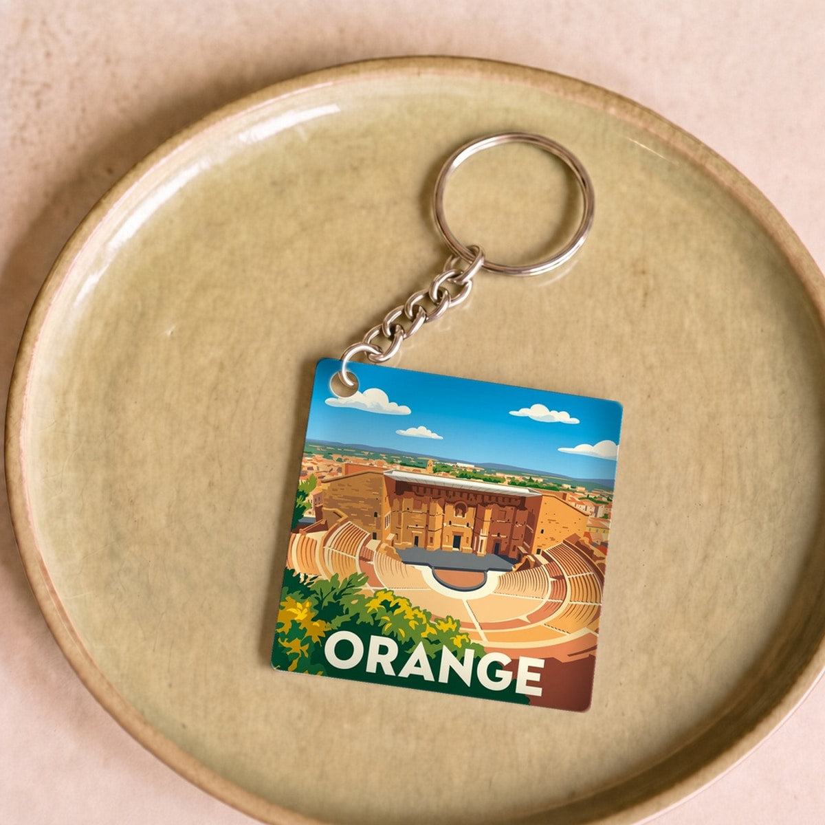 Porte-clés souvenir de la ville de Orange avec une illustration stylisée.