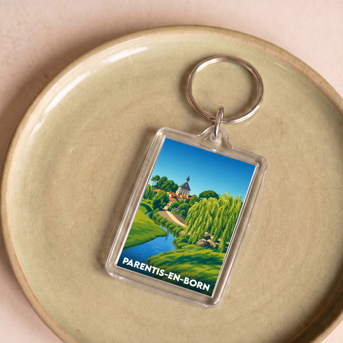 Porte-clés souvenir de la ville de Parentis-en-Born avec une illustration stylisée et colorée.