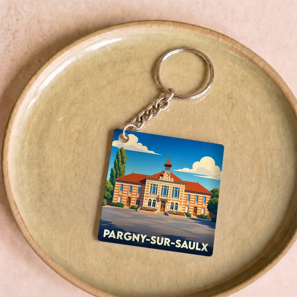 Porte-clés souvenir de la ville de Pargny-sur-Saulx avec une illustration stylisée de son hôtel de ville.