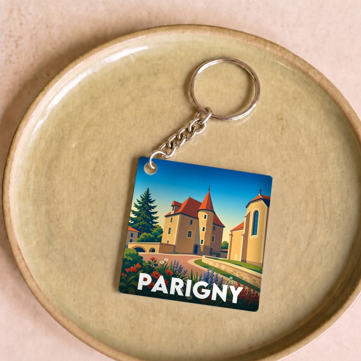 Porte-clés souvenir de la ville de Parigny avec une illustration stylisée.