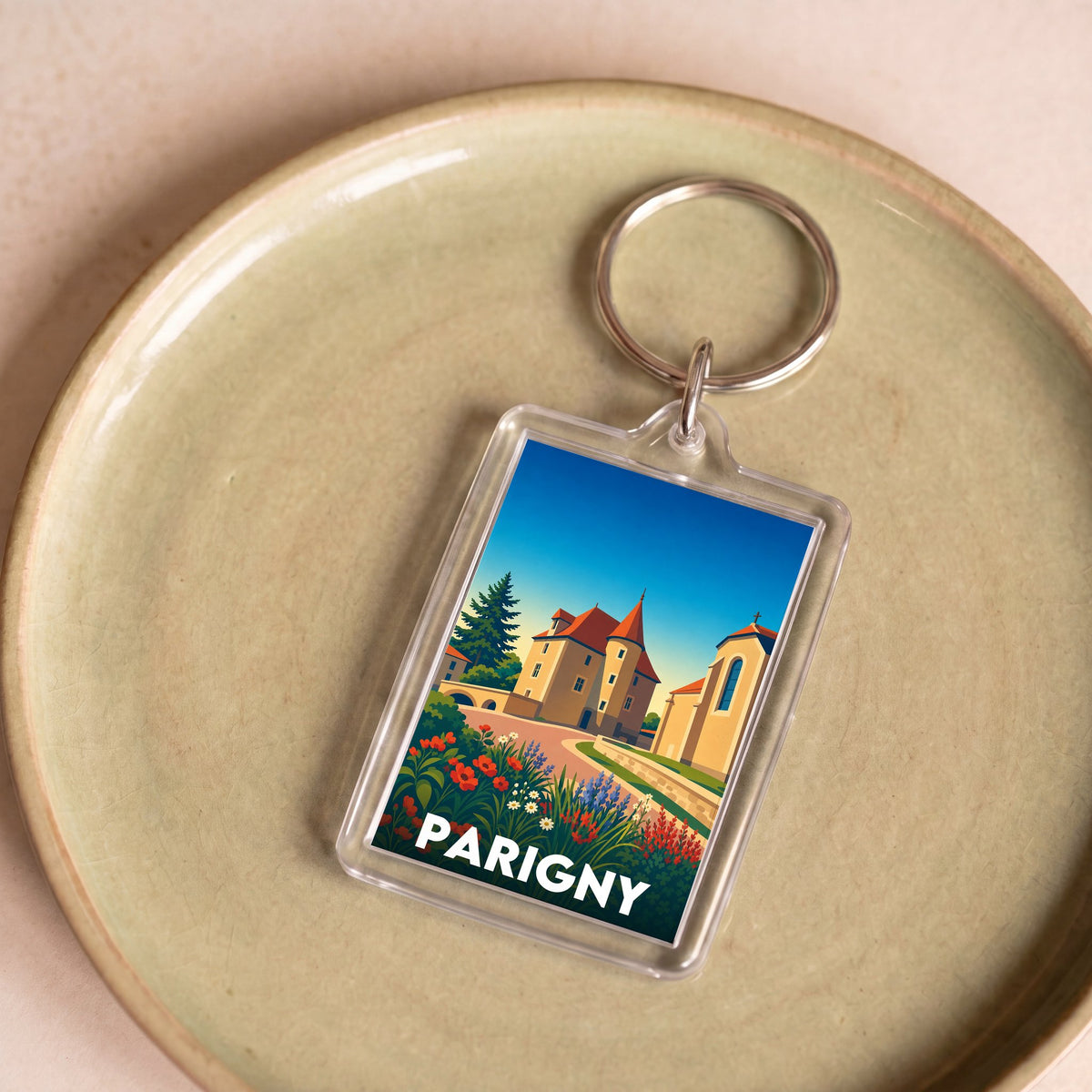 Porte-clés souvenir de la ville de Parigny avec une illustration stylisée.