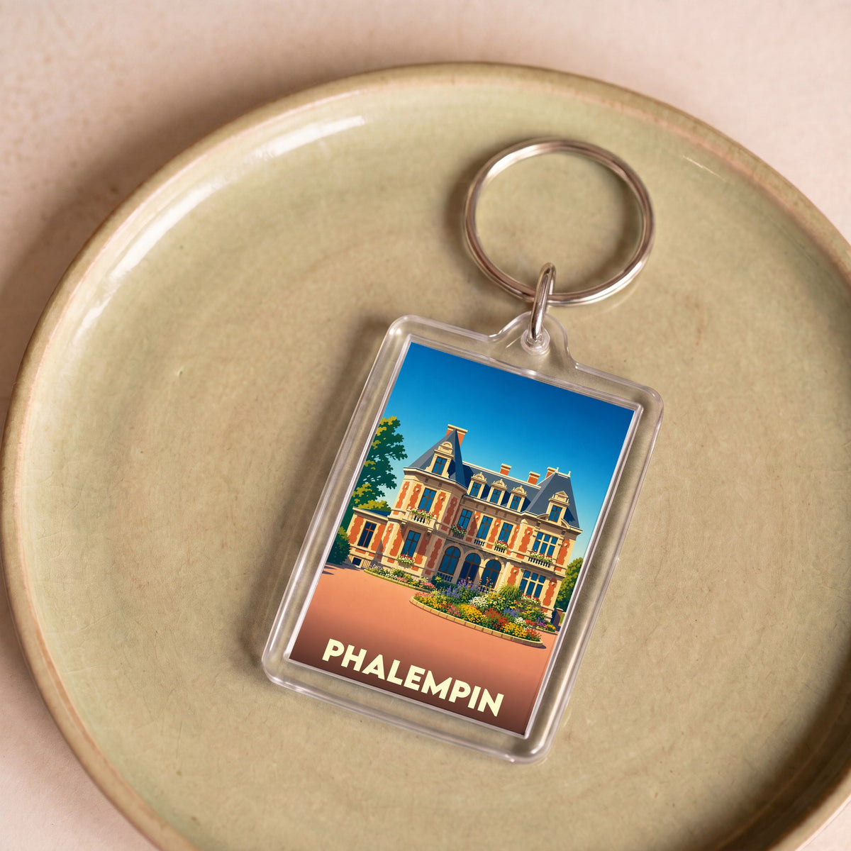 Porte-clés souvenir de la ville de Phalempin avec une illustration stylisée de son patrimoine.