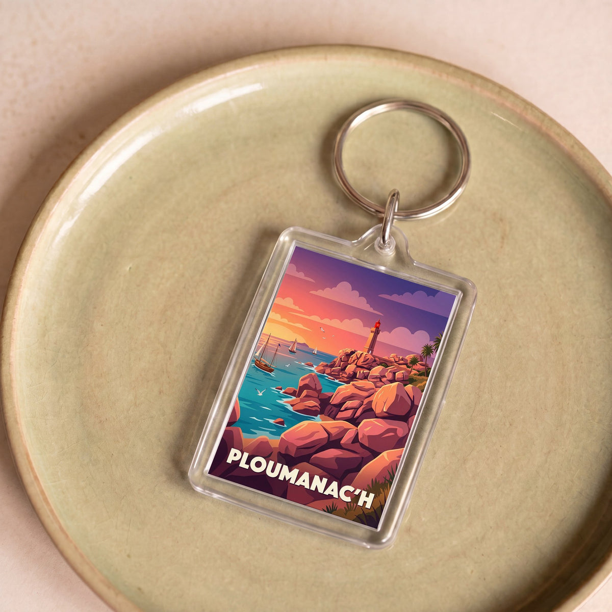 Porte-clés souvenir de la ville de Ploumanac'h avec une illustration stylisée.