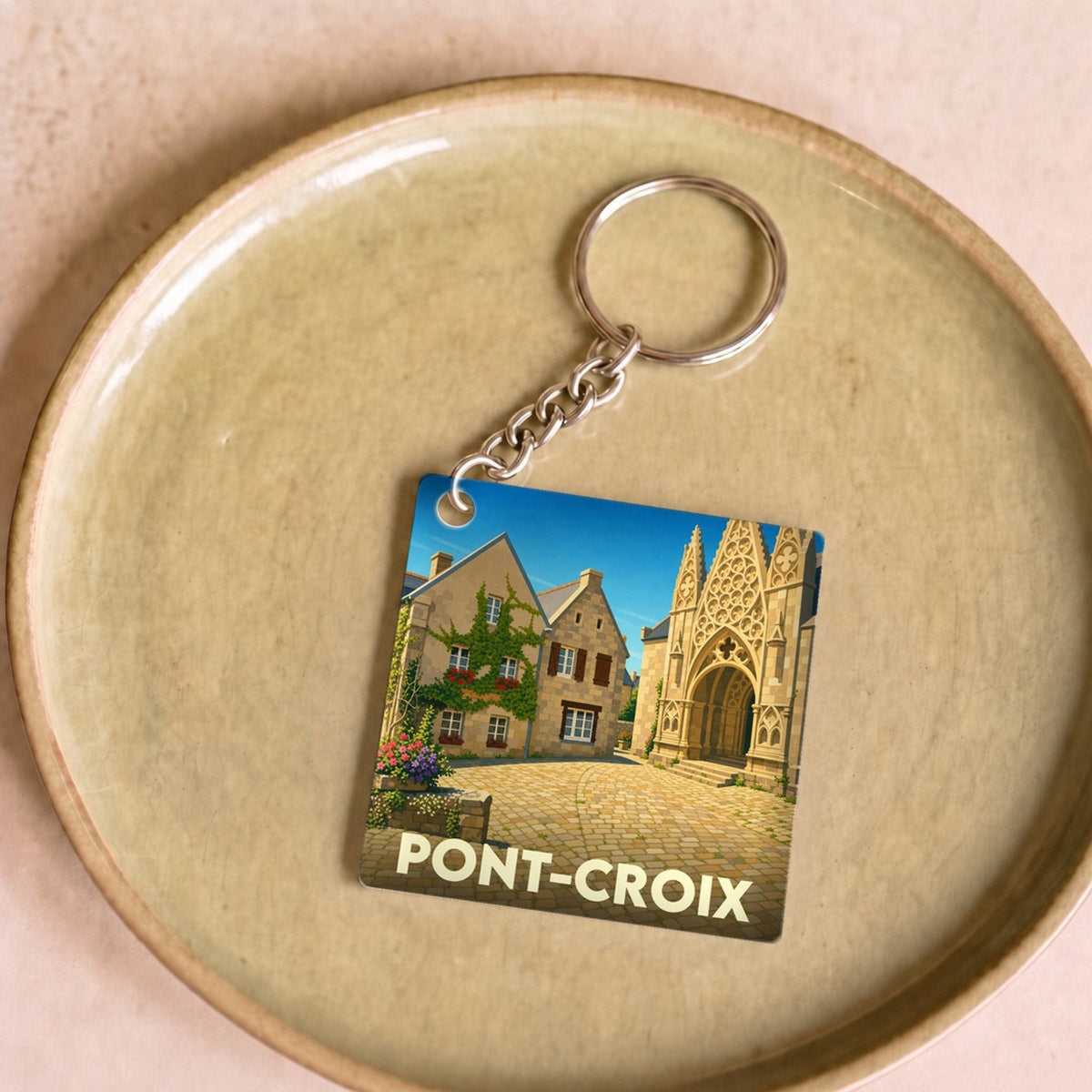 Porte-clés souvenir de la ville de Pont-Croix avec une illustration stylisée.