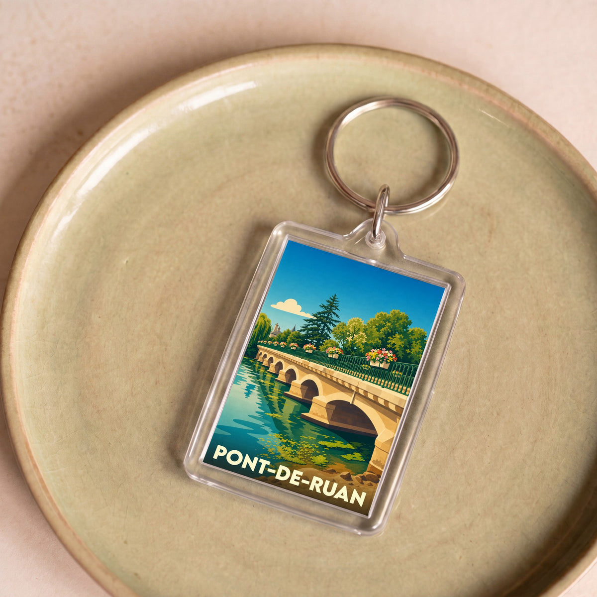 Porte-clés souvenir de la ville de Pont-de-Ruan avec une illustration stylisée de son pont.