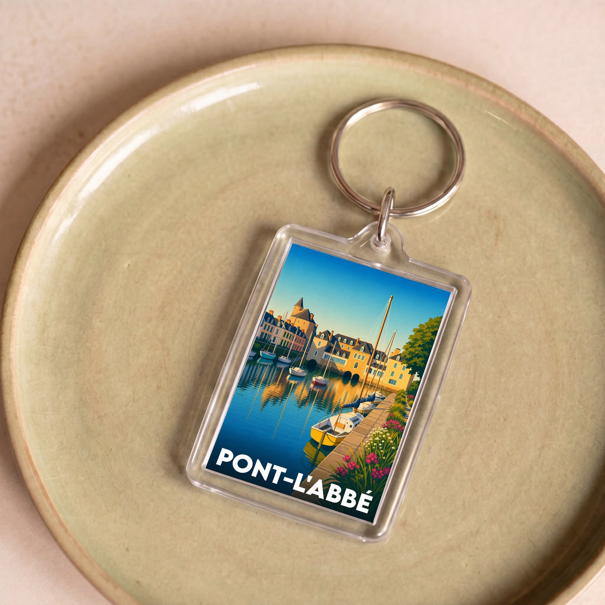 Porte-clés souvenir de la ville de Pont-l'Abbé avec une illustration stylisée.
