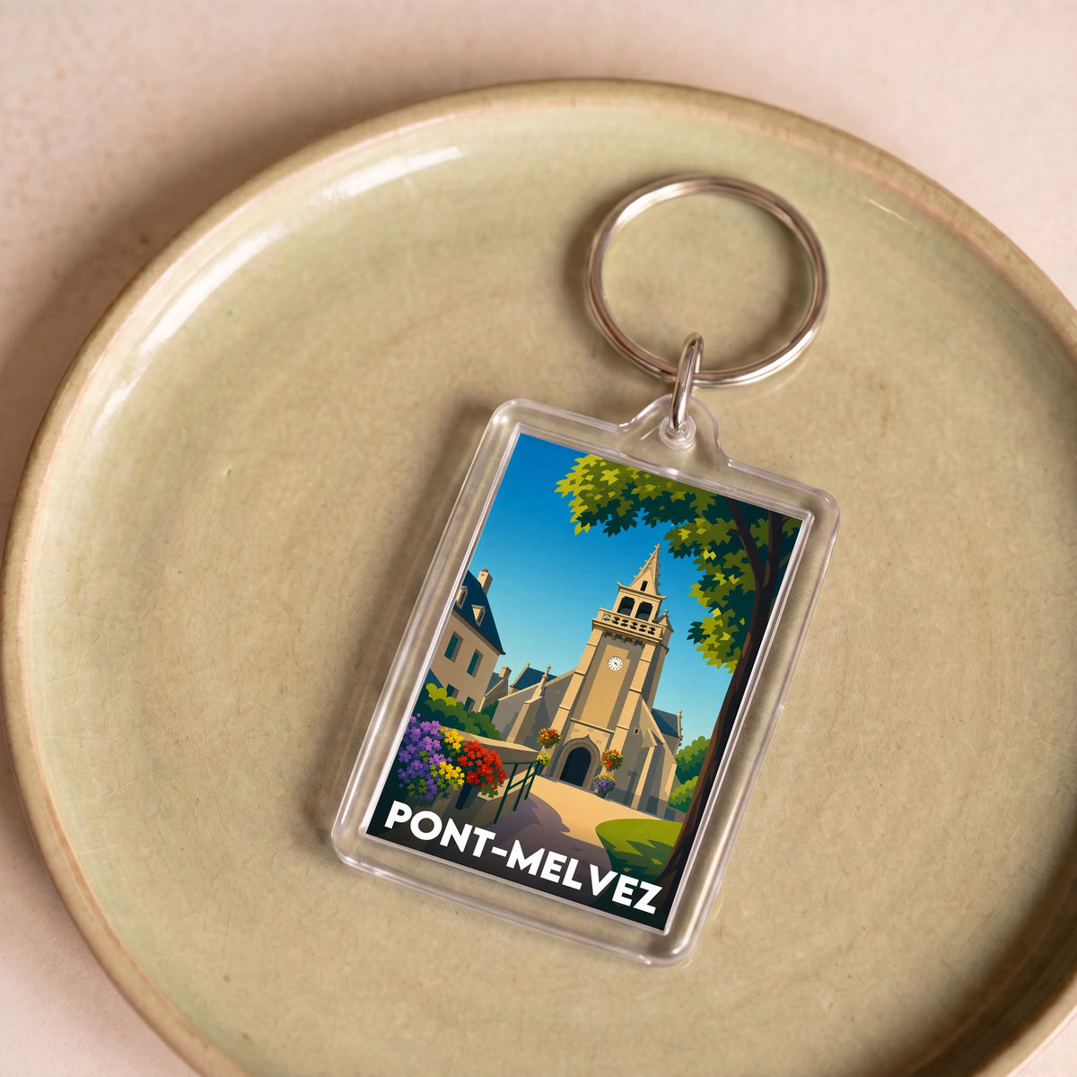 Porte-clés souvenir de la ville de Pont-Melvez avec une illustration stylisée.