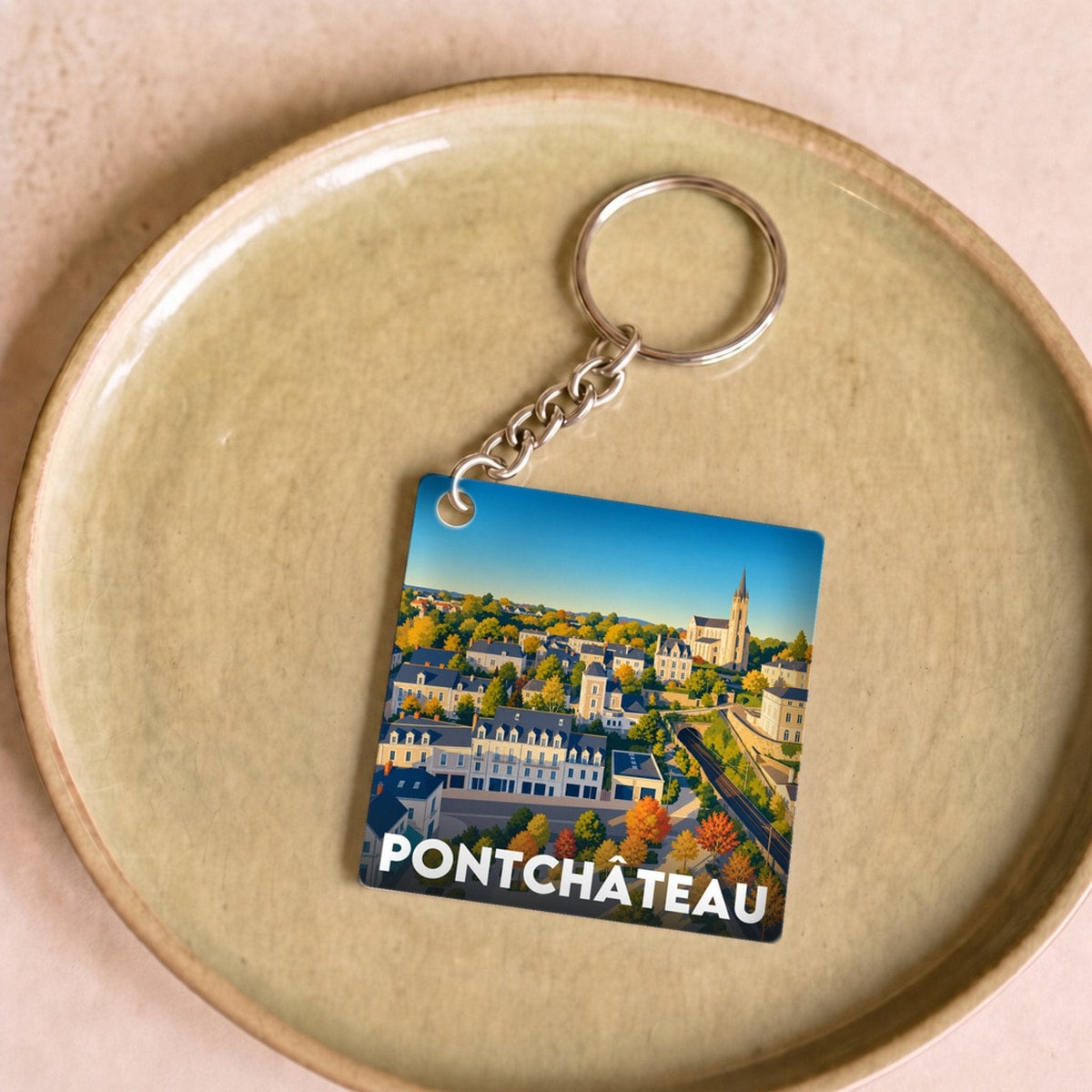 Porte-clés souvenir de la ville de Pontchâteau avec une illustration stylisée.