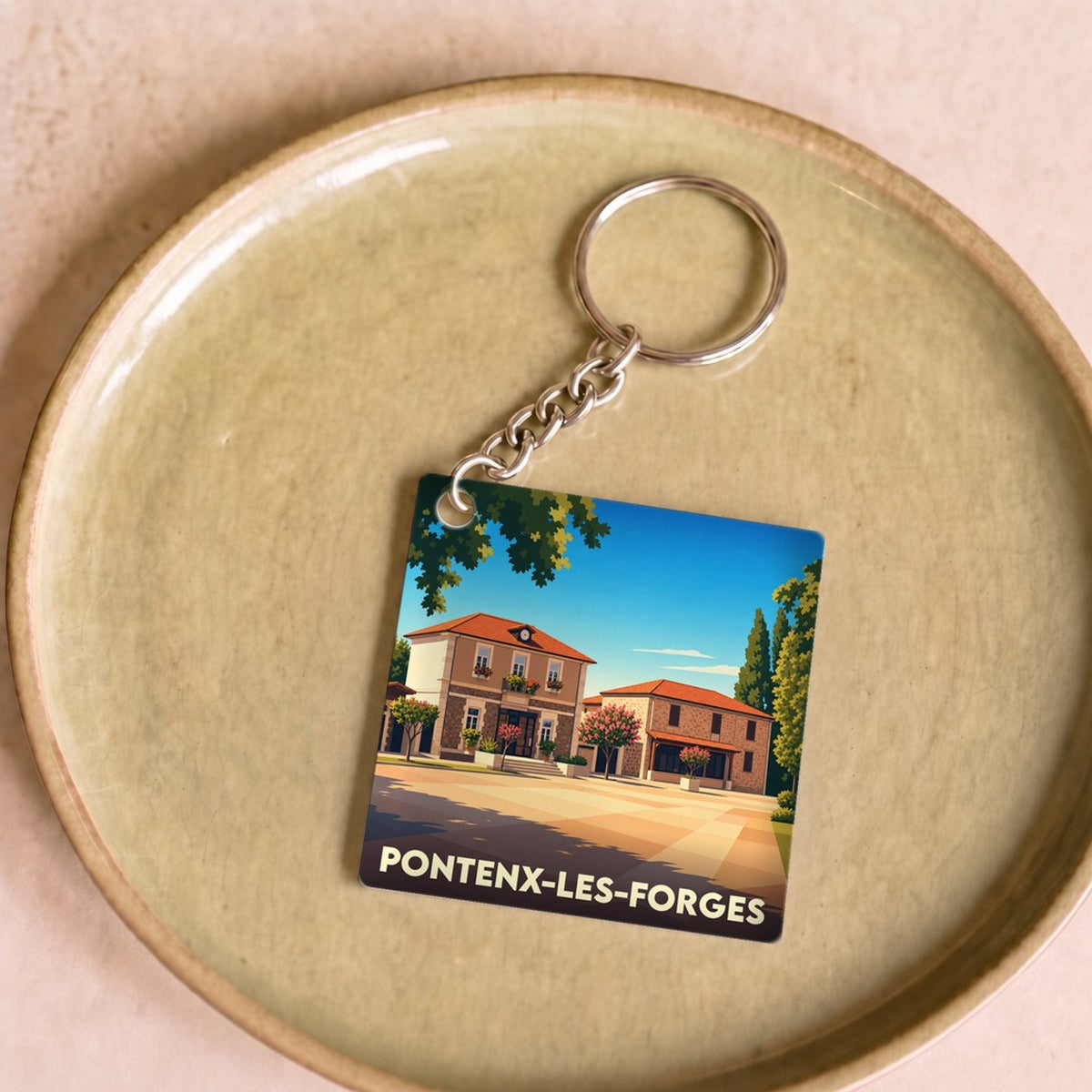 Porte-clés souvenir de la ville de Pontenx-les-Forges avec une illustration stylisée.