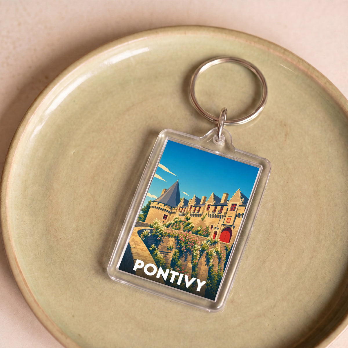 Porte-clés souvenir de la ville de Pontivy avec une illustration stylisée de son château.