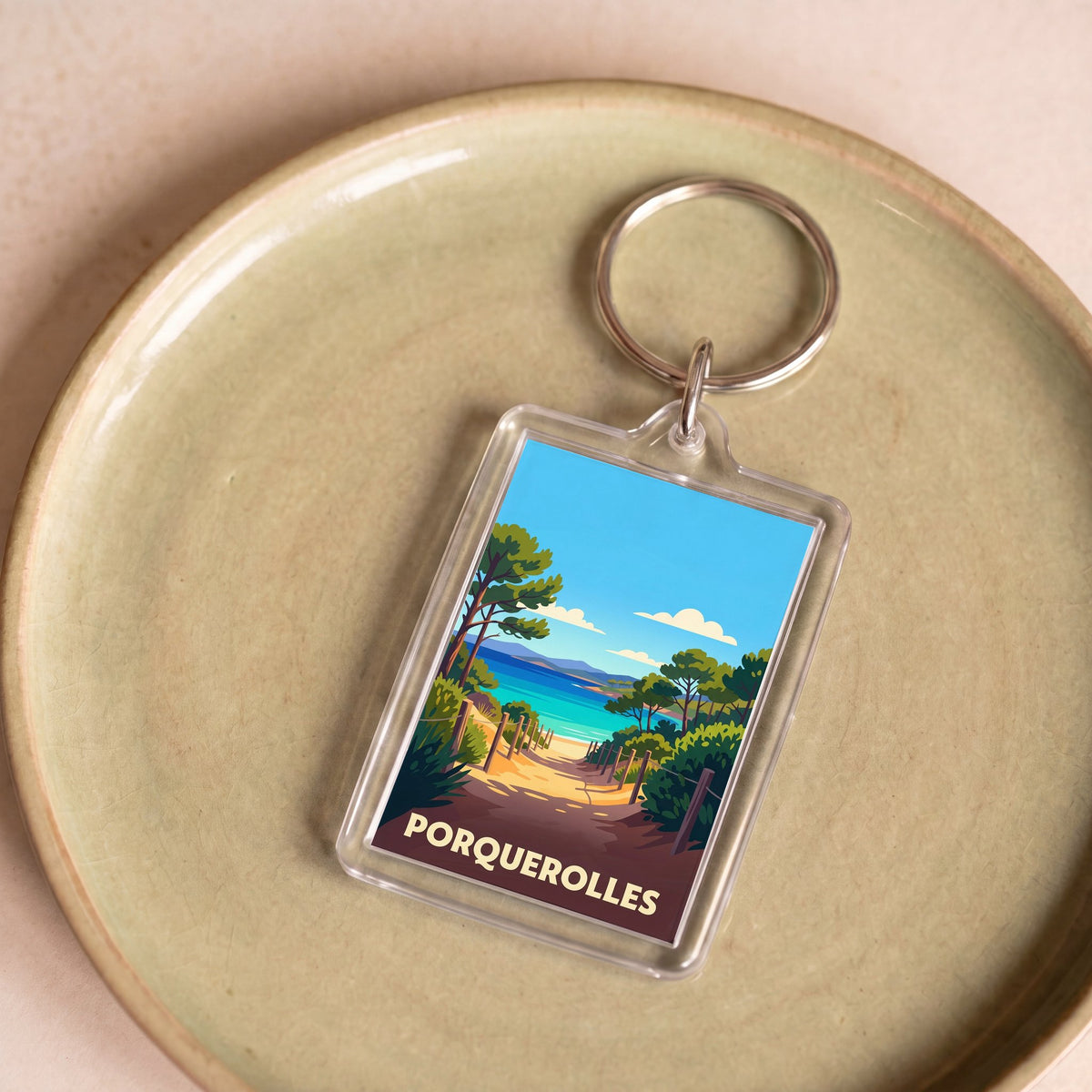 Porte-clés souvenir de la ville de Porquerolles avec une illustration stylisée.