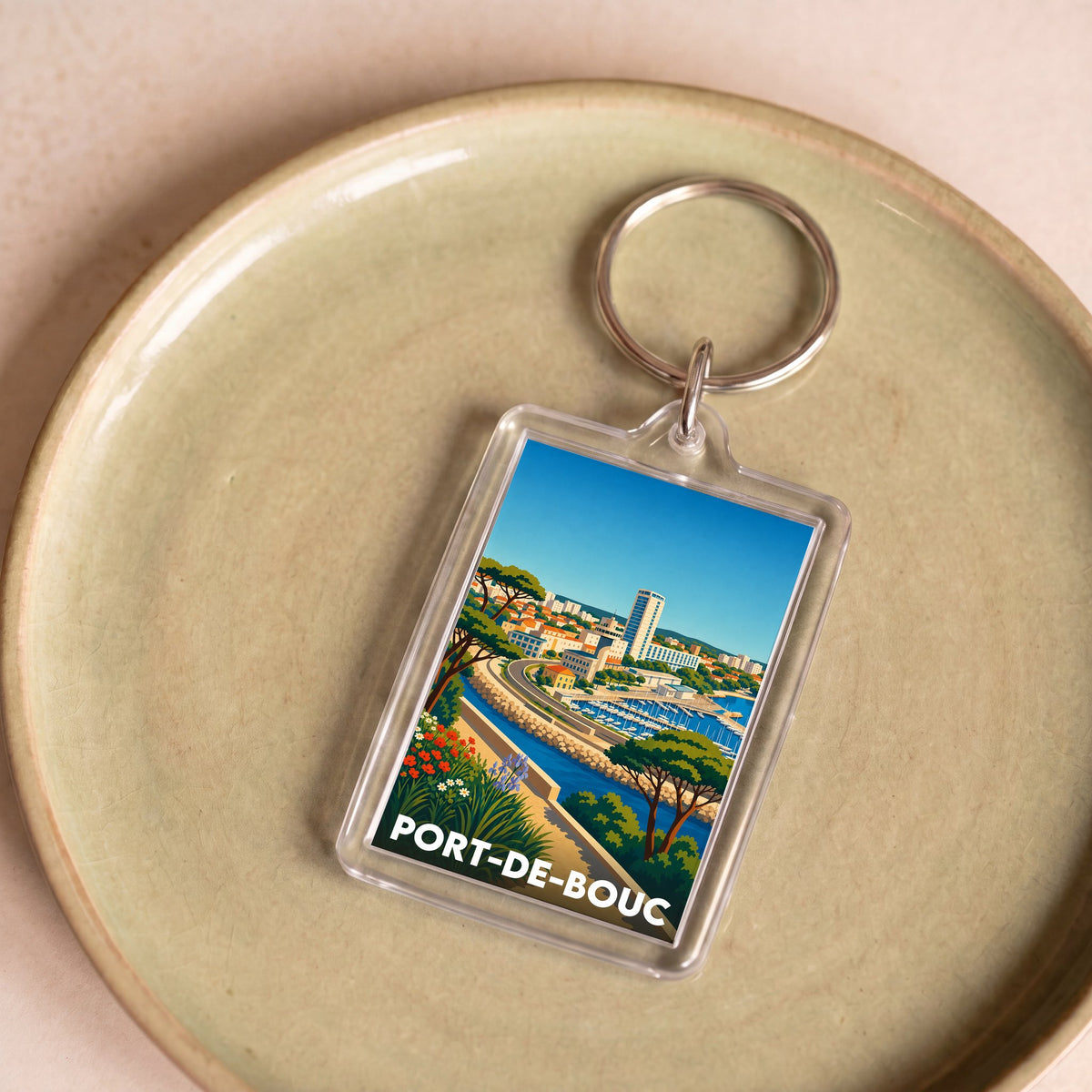 Porte-clés souvenir de la ville de Port-de-Bouc avec une illustration stylisée.