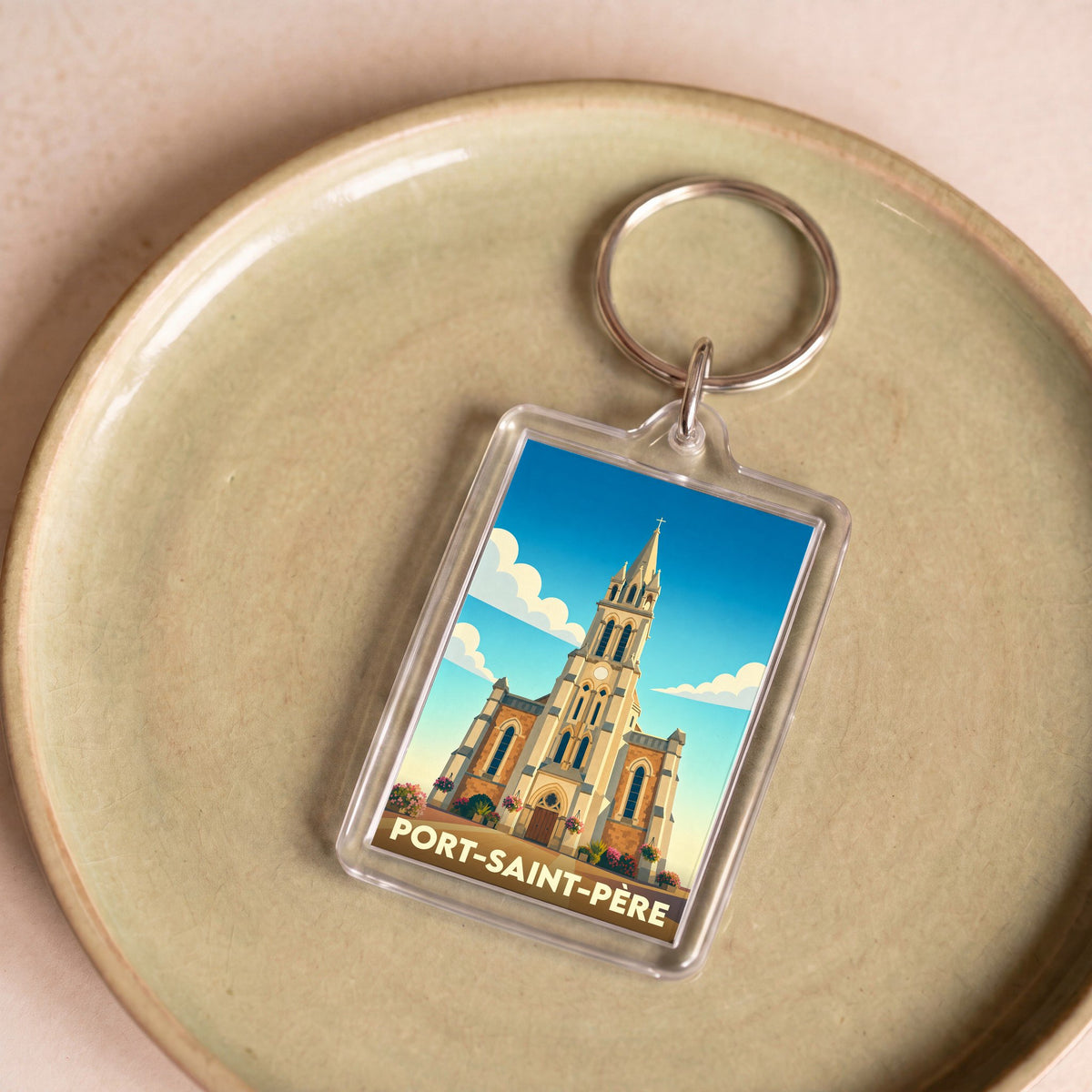 Porte-clés souvenir de la ville de Port-Saint-Père avec une illustration stylisée de son église.