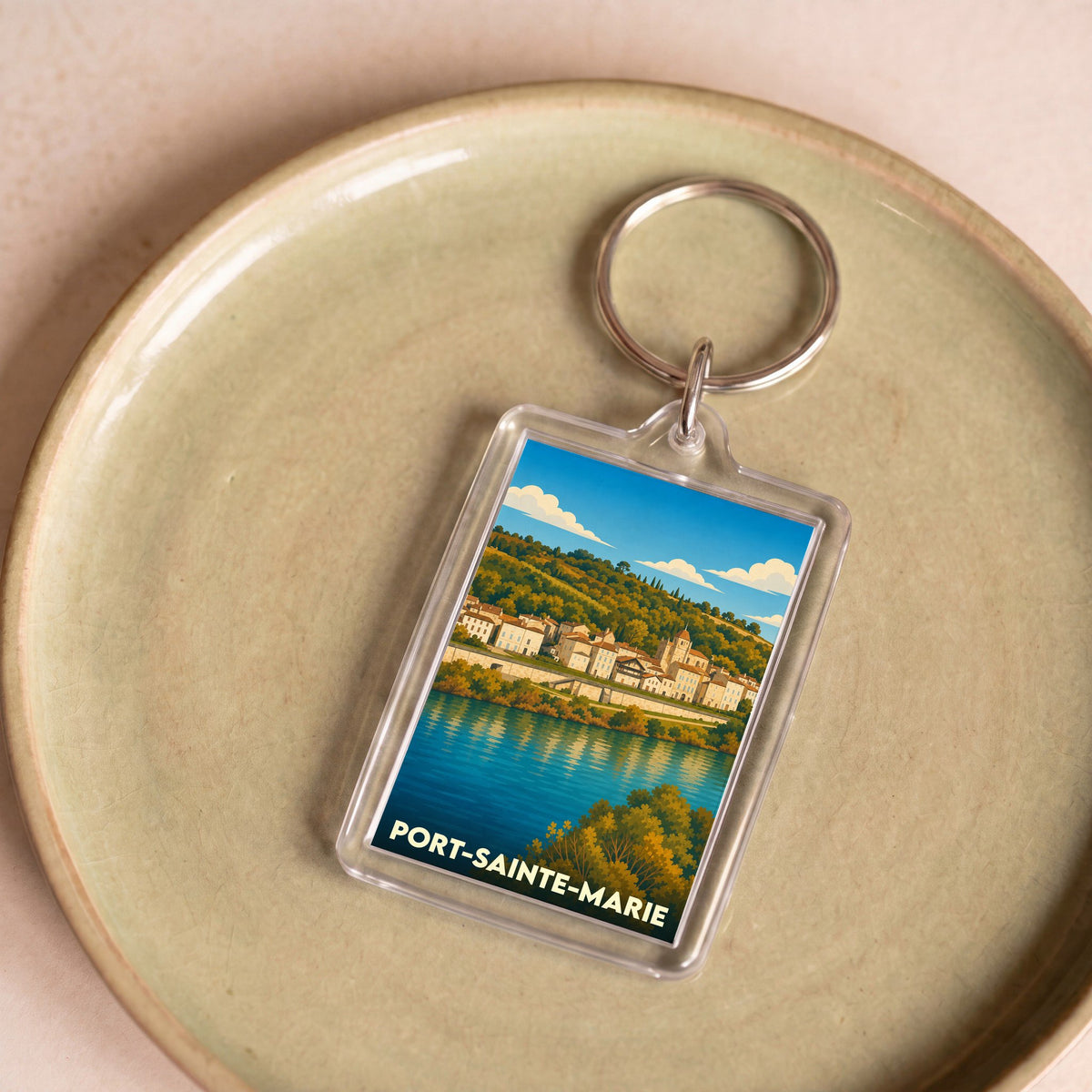 Porte-clés souvenir de la ville de Port-Sainte-Marie avec une illustration stylisée.